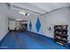 Spacious garage featuring ample storage, bicycle racks, and an electric car charging station at 1694 E Dogwood Ln, Gilbert, AZ 85295