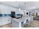 Bright kitchen featuring white cabinets, quartz countertops, and a stylish blue backsplash at 1694 E Dogwood Ln, Gilbert, AZ 85295