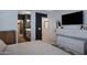 Modern main bedroom with tv, closet and bathroom access at 1694 E Dogwood Ln, Gilbert, AZ 85295