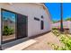 Backyard featuring sliding glass door and desert landscaping at 17025 E De Anza Dr, Fountain Hills, AZ 85268