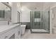 Modern bathroom with a soaking tub, glass-enclosed shower, and dual sink vanity at 17025 E De Anza Dr, Fountain Hills, AZ 85268