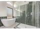 Contemporary bathroom with a freestanding tub, glass shower, and stylish tile work at 17025 E De Anza Dr, Fountain Hills, AZ 85268