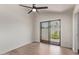 Light bedroom with ceiling fan and sliding glass door to backyard at 17025 E De Anza Dr, Fountain Hills, AZ 85268