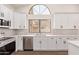 Updated kitchen featuring a stainless steel dishwasher and oven, along with quartz countertops at 17025 E De Anza Dr, Fountain Hills, AZ 85268