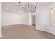 Large living room with high ceilings, hardwood floors, a chandelier and great natural light at 17025 E De Anza Dr, Fountain Hills, AZ 85268