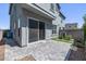 Backyard patio with gray pavers, sliding door and small grass area at 17118 N 50Th Way, Scottsdale, AZ 85254
