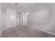 Bedroom featuring neutral walls, carpet, an open door, and double door closet at 17118 N 50Th Way, Scottsdale, AZ 85254