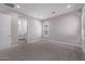 Bright bedroom with ensuite bathroom, neutral walls and gray carpet at 17118 N 50Th Way, Scottsdale, AZ 85254
