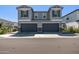 Well-maintained gray home featuring a two-car garage and manicured landscaping at 17118 N 50Th Way, Scottsdale, AZ 85254