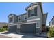 Charming gray house showcasing a well-designed exterior with a two-car garage at 17118 N 50Th Way, Scottsdale, AZ 85254