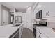 Close up of kitchen includes stainless steel appliances, white cabinetry, and countertops at 17118 N 50Th Way, Scottsdale, AZ 85254