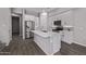 Spacious kitchen is equipped with stainless steel appliances, white cabinetry, and an island at 17118 N 50Th Way, Scottsdale, AZ 85254