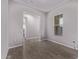 Cozy living room featuring wood-look tile floor and neutral walls at 17118 N 50Th Way, Scottsdale, AZ 85254