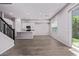 Spacious open floor plan with wood-look tile floor and staircase at 17118 N 50Th Way, Scottsdale, AZ 85254