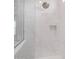 Modern shower featuring marble-look tile, a recessed niche, and brushed nickel shower head at 17118 N 50Th Way, Scottsdale, AZ 85254
