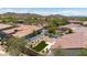 Aerial view of a backyard with manicured turf, surrounded by privacy walls and mature desert landscaping at 1720 W Aloe Vera Dr, Phoenix, AZ 85085