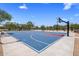 Community basketball court surrounded by mature landscaping and benches at 1720 W Aloe Vera Dr, Phoenix, AZ 85085