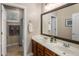 Modern bathroom with double vanity, wooden cabinets, and a shower/tub combo in a well-lit space at 1720 W Aloe Vera Dr, Phoenix, AZ 85085