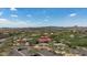 Aerial view of community pool and amenity center surrounded by desert landscaping and beautiful mountain views at 1720 W Aloe Vera Dr, Phoenix, AZ 85085