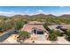 Charming single-story home with tile roof and three-car garage, set against a stunning mountain backdrop at 1720 W Aloe Vera Dr, Phoenix, AZ 85085