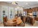 Charming kitchen and breakfast nook, featuring wooden cabinets, stainless appliances, and open to the living room at 1720 W Aloe Vera Dr, Phoenix, AZ 85085
