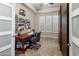 Bright home office with sewing space, natural light from the window, and custom storage solutions at 1720 W Aloe Vera Dr, Phoenix, AZ 85085