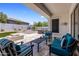 Covered patio featuring a fire pit, built-in spa, and comfortable seating for entertaining at 1720 W Aloe Vera Dr, Phoenix, AZ 85085