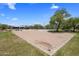 Community sand volleyball court surrounded by grassy area and picnic seating at 1720 W Aloe Vera Dr, Phoenix, AZ 85085