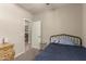 Bedroom featuring neutral colors, a closet, and view into hall, creating a calm environment at 17444 W Via De Luna Dr, Surprise, AZ 85387