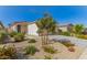 Charming single-story home featuring low maintenance landscaping and a two-car garage at 17444 W Via De Luna Dr, Surprise, AZ 85387