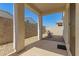 Comfortable covered patio space complete with rocking chairs and a clear view to the backyard at 17444 W Via De Luna Dr, Surprise, AZ 85387