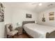 Bedroom features a neutral color scheme and is decorated with Southwest-themed artwork at 17796 W Andora St, Surprise, AZ 85388