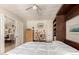 Bedroom features built-in bookshelves and is connected to the adjacent dining room for flexible living at 17796 W Andora St, Surprise, AZ 85388
