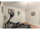 Home exercise room equipped with an elliptical machine, training bench, and abstract artwork at 17796 W Andora St, Surprise, AZ 85388