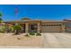 Charming single-story home featuring a neutral color scheme, well-maintained landscaping, and an American flag at 17796 W Andora St, Surprise, AZ 85388