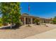 Charming single-story home featuring a neutral color scheme and a well-maintained xeriscaped front yard at 17796 W Andora St, Surprise, AZ 85388