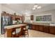 Well-equipped kitchen features granite countertops, a center island, and stainless steel appliances at 17796 W Andora St, Surprise, AZ 85388