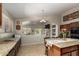 Modern kitchen offers an open layout, granite countertops, and a view of the backyard pool at 17796 W Andora St, Surprise, AZ 85388