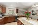 Cozy kitchen featuring granite countertops, ample cabinet space, and modern appliances at 17796 W Andora St, Surprise, AZ 85388