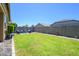 Spacious backyard with well-manicured lawn and ample space for outdoor activities and entertaining guests at 18027 W Tina Ln, Surprise, AZ 85387