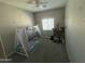 Playful bedroom featuring a tent bed, a window, and decorative wall stickers at 1814 W Minton St, Phoenix, AZ 85041