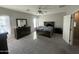 Cozy main bedroom with a comfortable bed, dark wood furniture set, and neutral-toned walls at 1814 W Minton St, Phoenix, AZ 85041