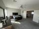Spacious main bedroom with a ceiling fan, dresser, and open doorway, offering ample natural light at 1814 W Minton St, Phoenix, AZ 85041