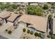 A high-angle view shows the home's landscaping and architecture with nearby homes at 19102 N 91St St, Scottsdale, AZ 85255