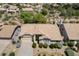 An aerial view showcasing the home's roof, landscaping, and neighborhood at 19102 N 91St St, Scottsdale, AZ 85255