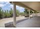 Covered back patio overlooking lush desert landscaping at 19102 N 91St St, Scottsdale, AZ 85255