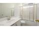 Bathroom with a vanity, sink, and a shower with glass doors at 19102 N 91St St, Scottsdale, AZ 85255