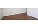 Bedroom with hardwood floors, white baseboards and a white door at 19102 N 91St St, Scottsdale, AZ 85255