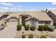 Charming single-story home with a well-manicured front yard and desert landscaping at 19102 N 91St St, Scottsdale, AZ 85255