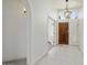 Inviting foyer with neutral tile flooring and decorative lighting fixtures at 19102 N 91St St, Scottsdale, AZ 85255